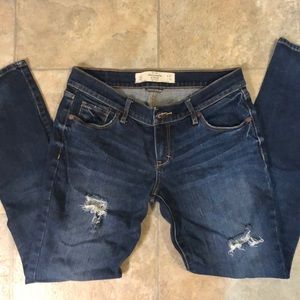 Dark wash jeans with distressed holes